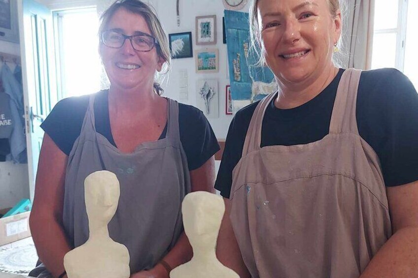 Happy visitors with their hand made souvenirs.