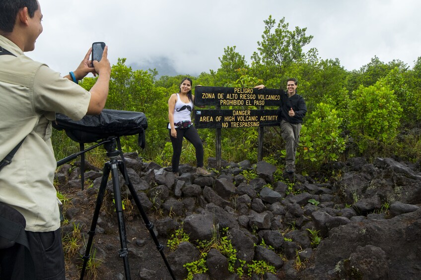 Couple taking a photo on the Arenal Volcano National Park Walk 