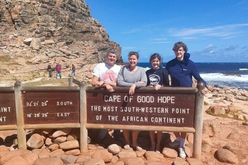 Radiant smiles as happy guests soak in the breathtaking views at Cape Point, a highlight of their unforgettable journey through the Cape of Good Hope