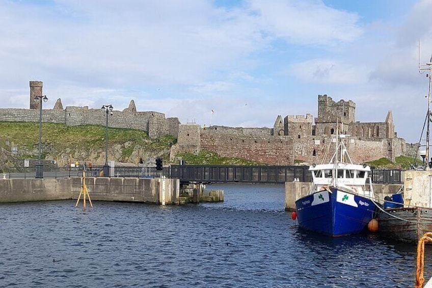 Peel Harbour and fishing boats with a backdrop of Peel Castle