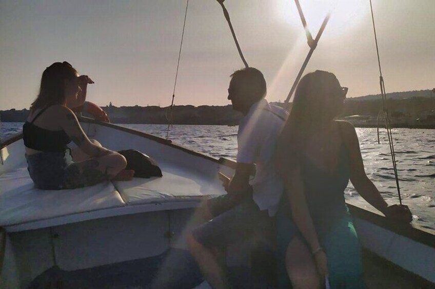 Aci Trezza boat tour sunset and dinner sicilian family home