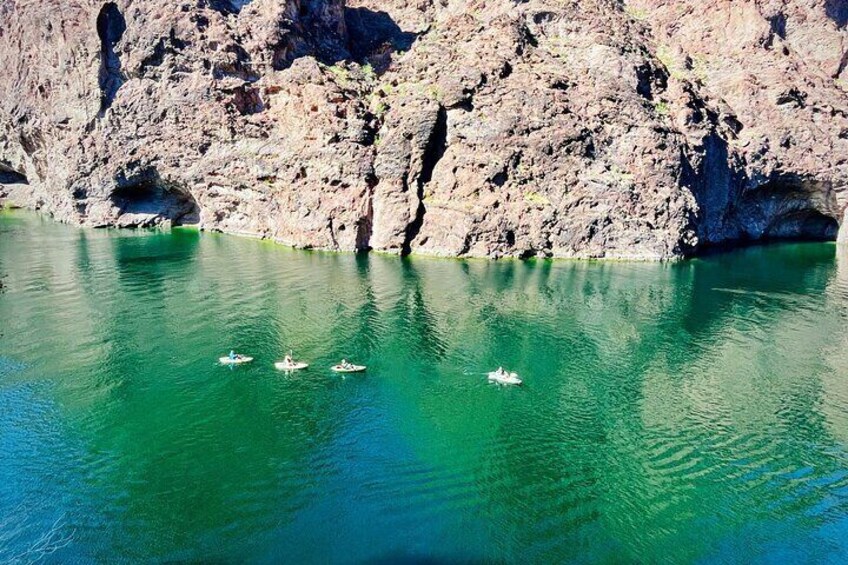 Our kayak tours offer an immersive experience, allowing you to discover hidden gems and breathtaking scenery along the tranquil waters of the Black Canyon narrows and the mesmerizing Emerald Cave.