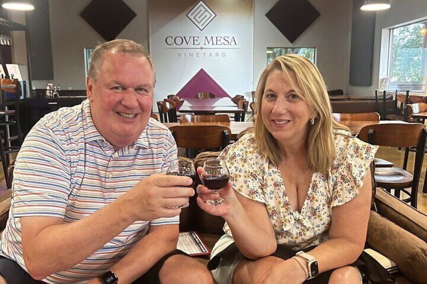 Customers enjoying wine at Cove Mesa Vineyard
