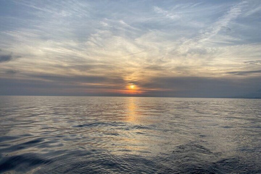 Sailing at sunset along the cliffs of Maro-Compartida