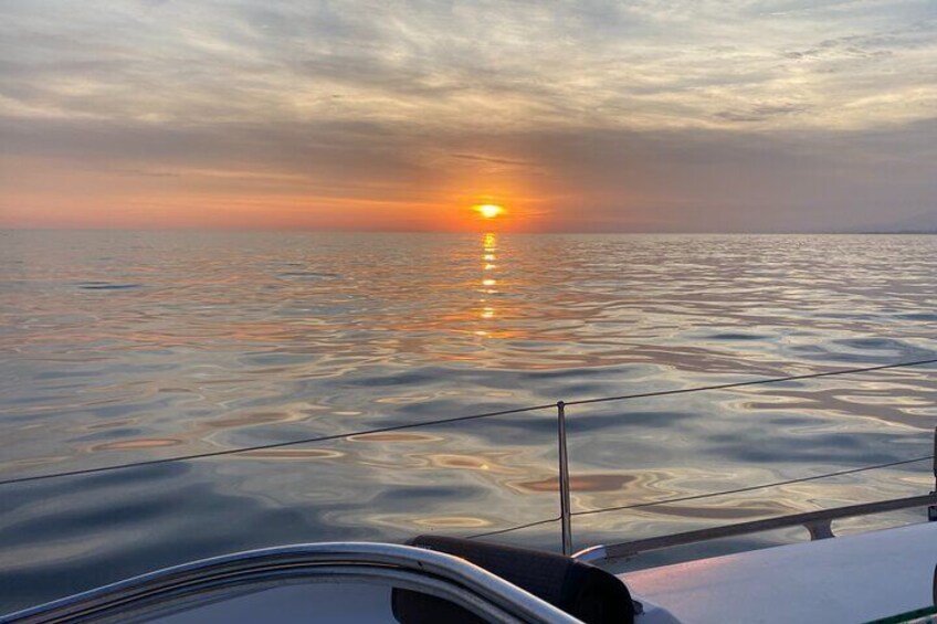 Sailing at sunset along the cliffs of Maro-Compartida