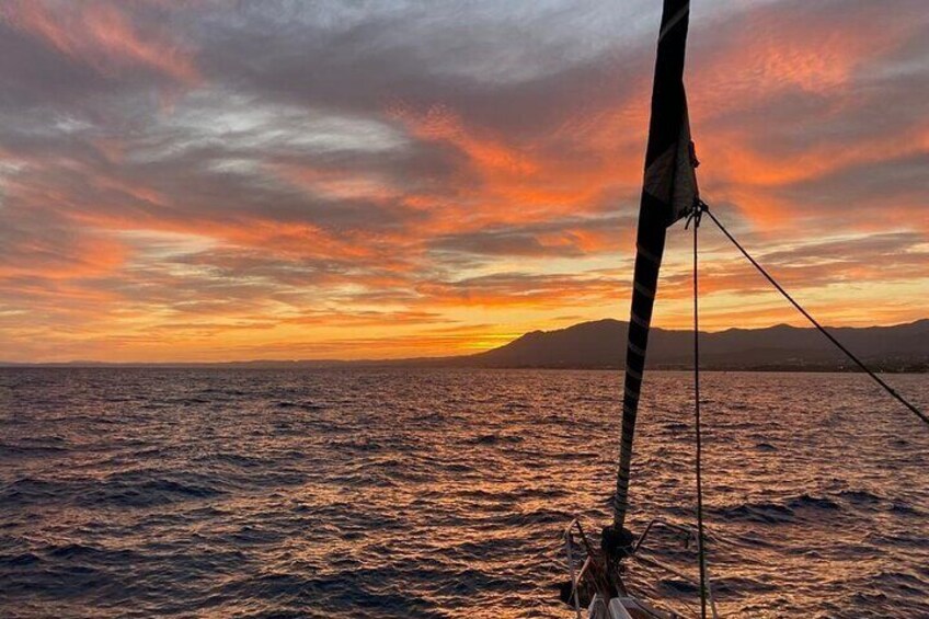 Sunset sailing along the cliffs of Maro- Private