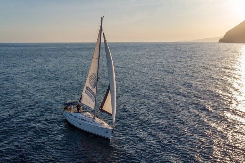 Sunset sailing along the cliffs of Maro- Private