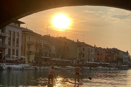 Sup experience with a ride to Peschiera del Garda Lake Garda