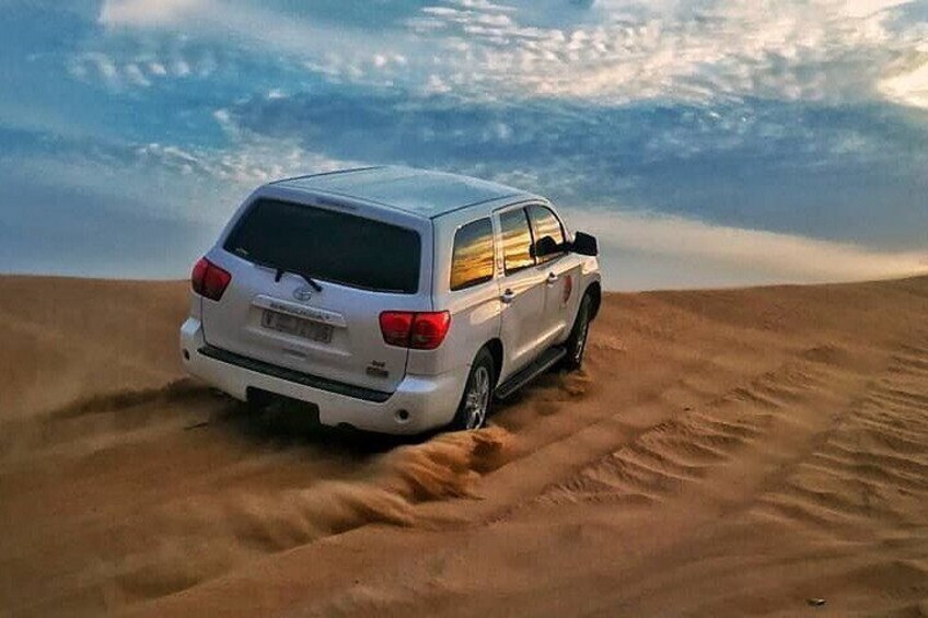 Dubai Desert Safari with Sand Boarding, BBQ Dinner, Camel ride