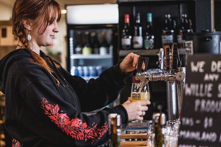 Pouring ciders at Willie Smiths Apple Shed