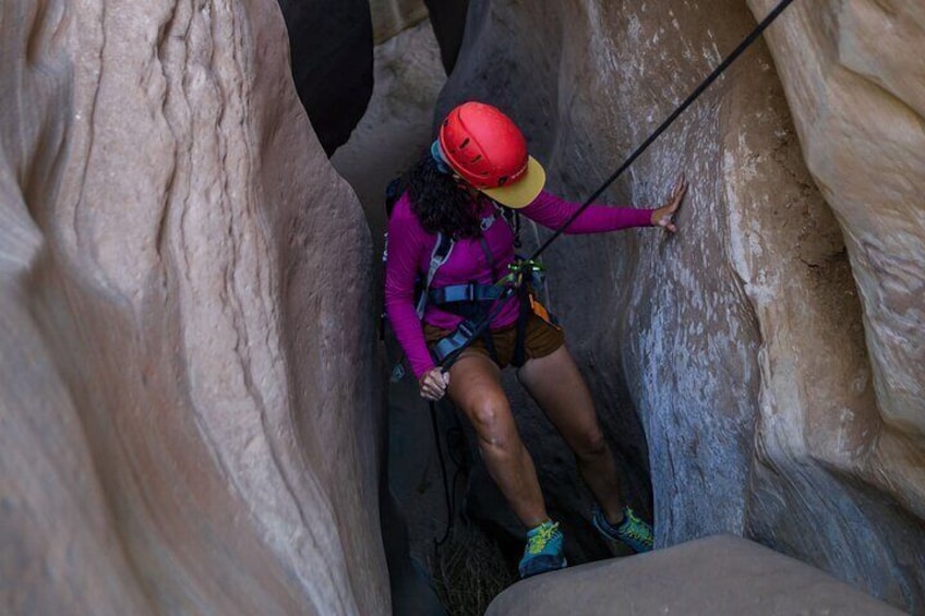 Rappelling through Slot Canyon