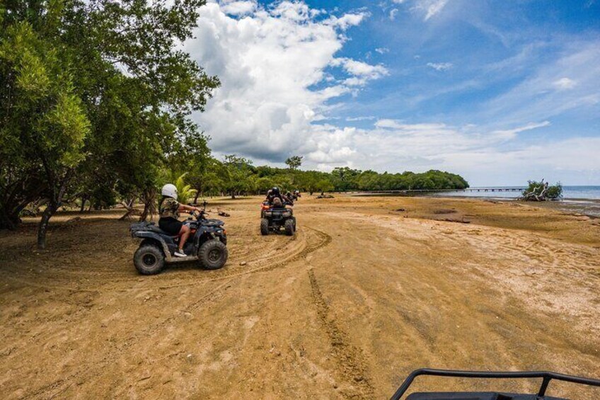 Guided ATV Tour on Mountain Dirt Road with Views of Roatan