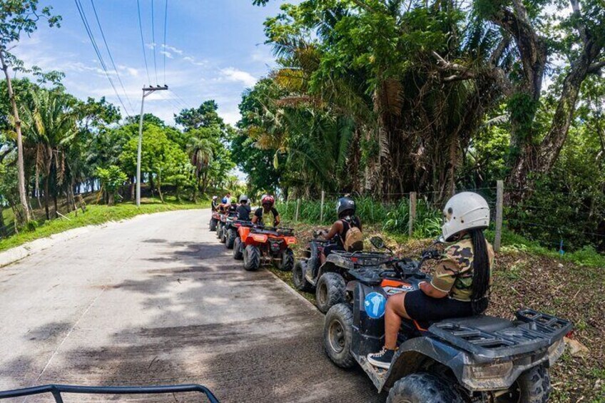 Guided ATV Tour on Mountain Dirt Road with Views of Roatan