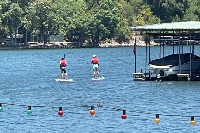 PaddleBoarders Heading out past the marina