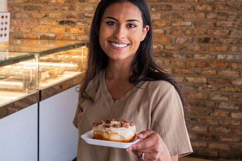 Guest smiling with her decorated donut