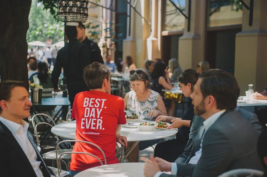 Show item 3 of 10. People eating at outdoor restaurant in Vienna