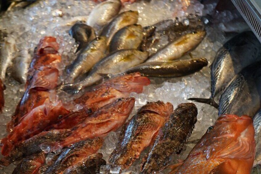 A local fish shop; You can choose fresh fish to eat.