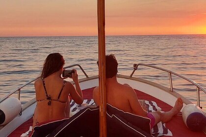 Sunset on a boat in Capri on the Classic Gozzo