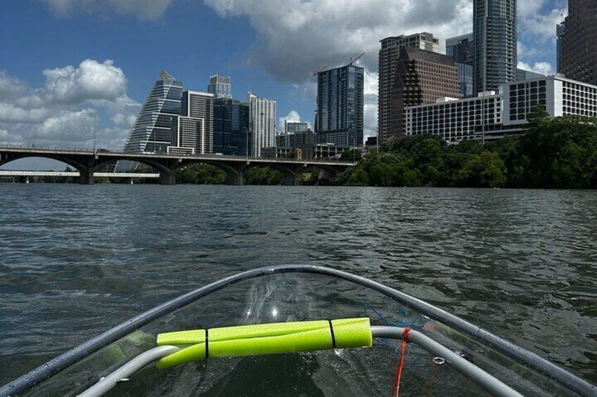 Clear kayaking on Lady Bird Lake in Downtown Austin, Texas - observing the Austin Skyline