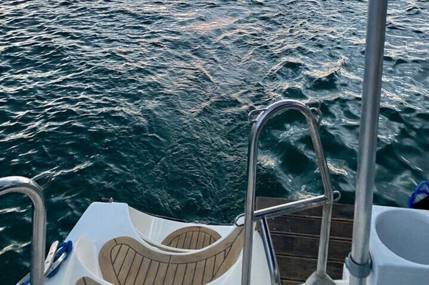 The evening, the best time for a swim under anchor.