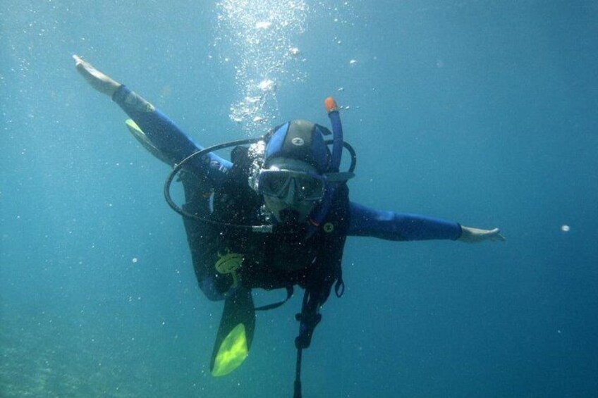 Young boy doing his first time diving in Tucepi.