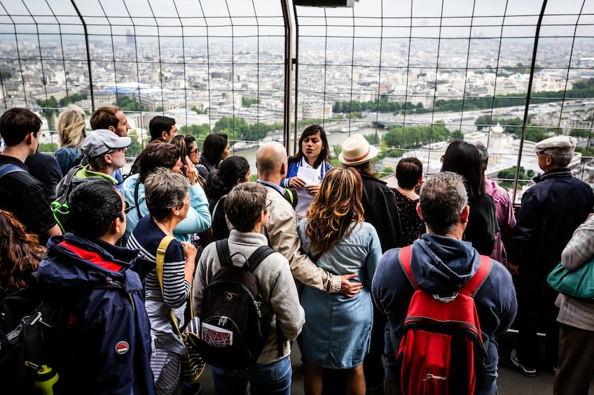 Tour group at observation deck on the Eiffel Tower in Paris
