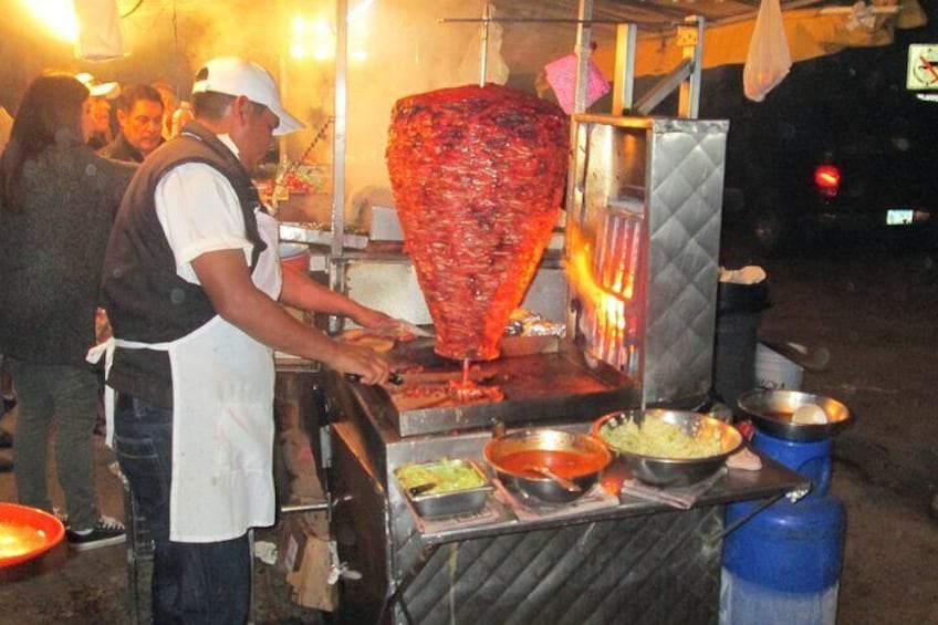 Street food at its best with al pastor tacos.