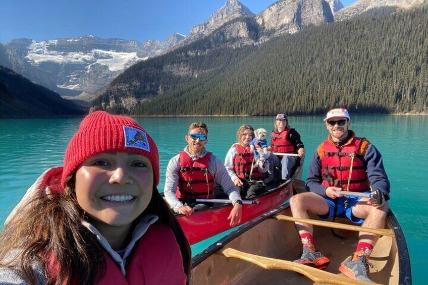 Group of friends paddling on Lake Louise.