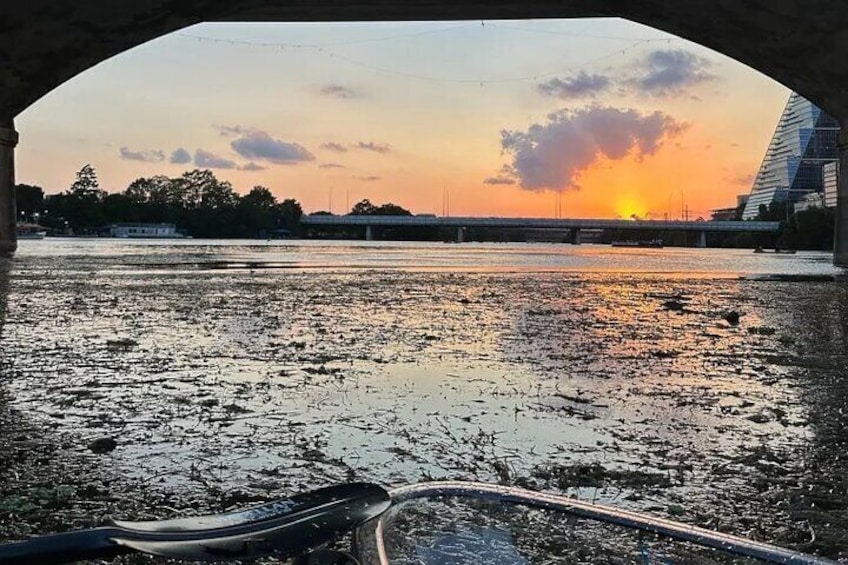 Clear Kayak overlooking the sunset towards Barton Creek from Downtown Austin, Texas from the South Lamar bridge on Lady Bird Lake