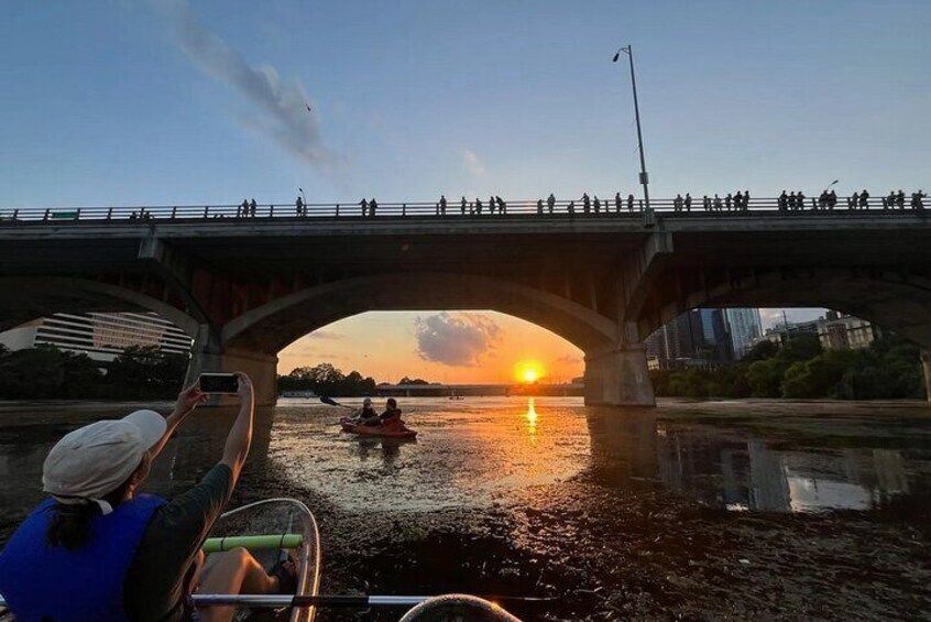 Capture a mesmerizing sunset along Lady Bird Lake during our clear kayak sunset tour! This is the famous South Congress Avenue bridge on Lady Bird Lake to observe bats at sunset.