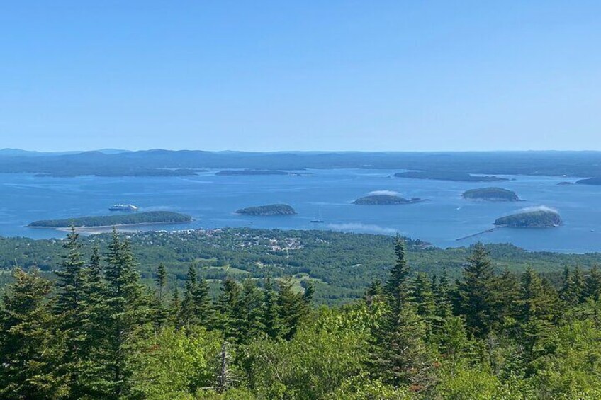 Looking down toward Bar Harbor from the Cadillac Mountain Summit Road. Sometimes the fog gives the Porcupine Islands misty hats.