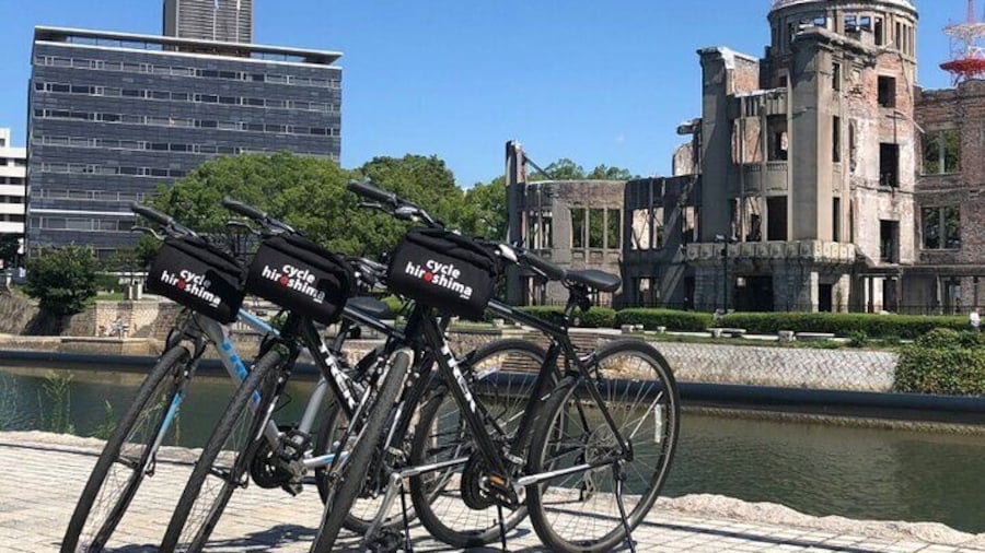 Biking by the iconic Atomic Bomb Dome in Hiroshima's Peace Memorial Park.