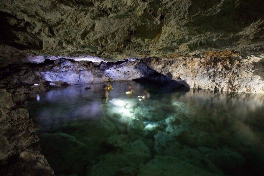 Delve deeper in the unlit sections of the cave pool