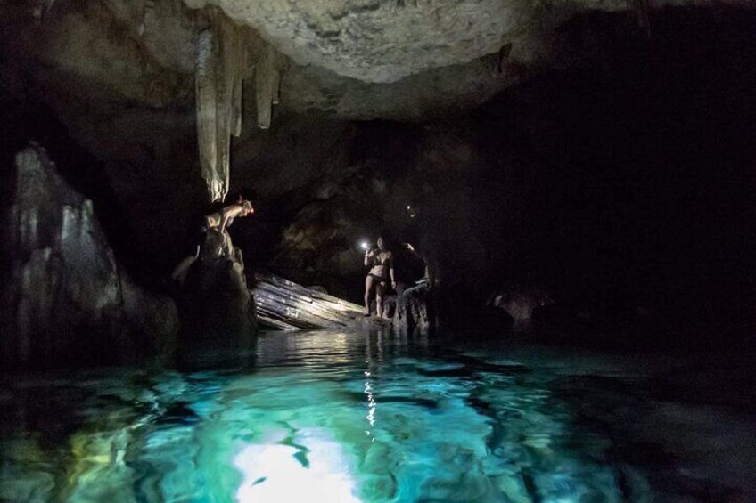 Delve deeper in the unlit sections of the cave pool