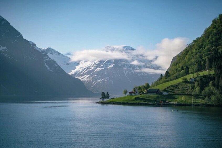 Hjørundfjord. The tour starts by boat through Hjørundfjord with stop along the way at Trandal, Sæbø, Urke and Øye.