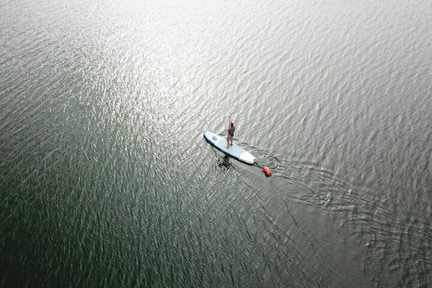 Paddle Board Trip: connect to the tranquil waters of the Guatapé Reservoir on a paddleboard.