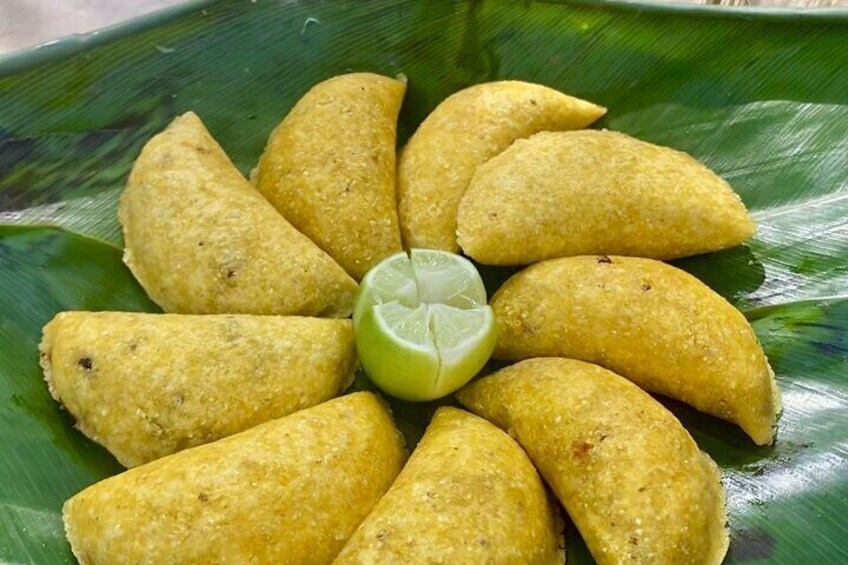 Empanadas, hot and ready to devour! Dive into a delicious spread of freshly fried empanadas, each one bursting with savory fillings and golden, crispy perfection. 