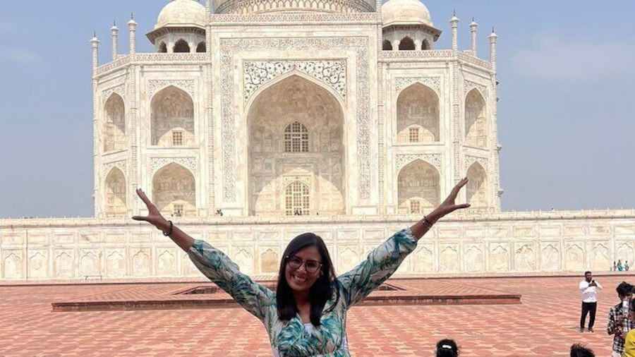 Our happy, solo traveller at Taj Mahal