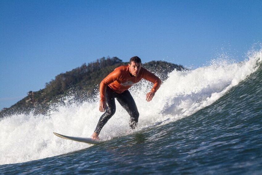 Photo from inside the water of a client applying the surfing technique