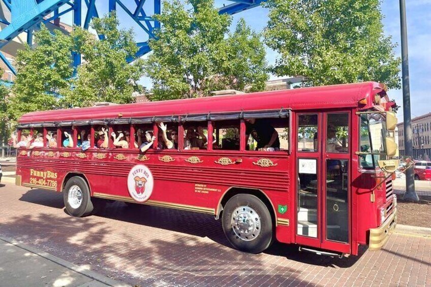 Guests smiling & waving as we tour Cleveland.