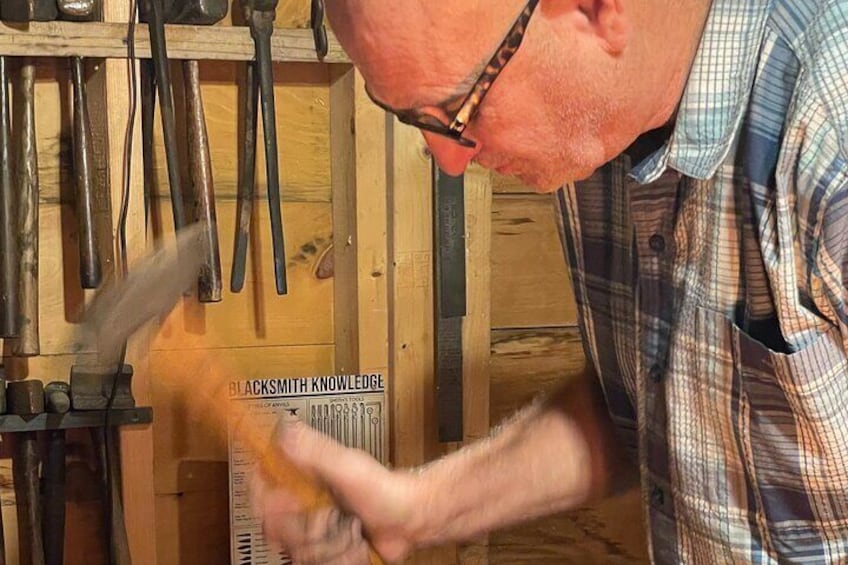 See how to hold a hammer and the techniques of blacksmithing.