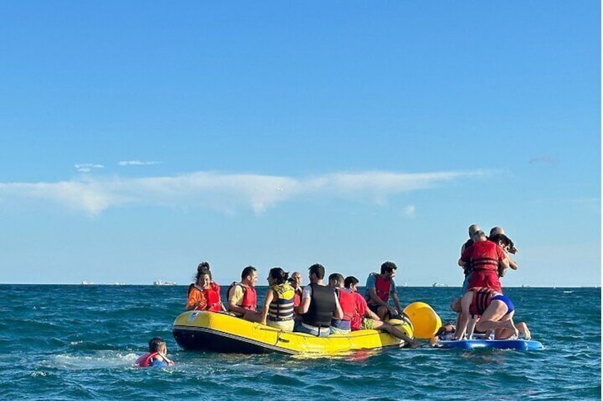 racing with our raft in the beautiful sea of Barcelona