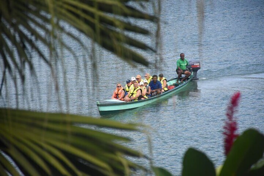 Long Boat arriving at the village