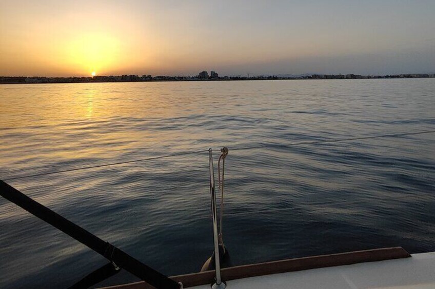 Sailing with sunset and swimming in the sea