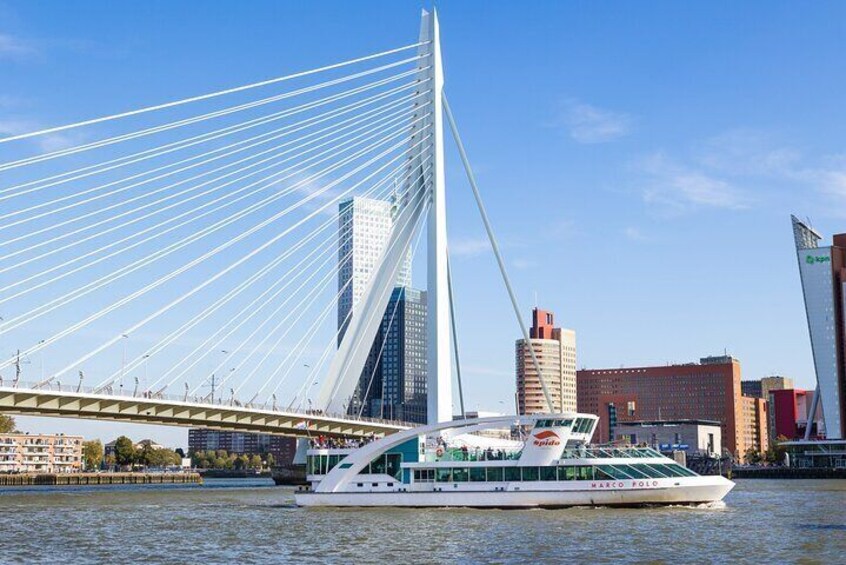 Ferry passing-by the Erasmus bridge in Rotterdam.