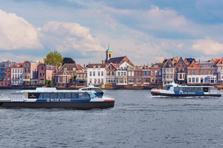 The ferry passing-by the Dordrecht skyline.