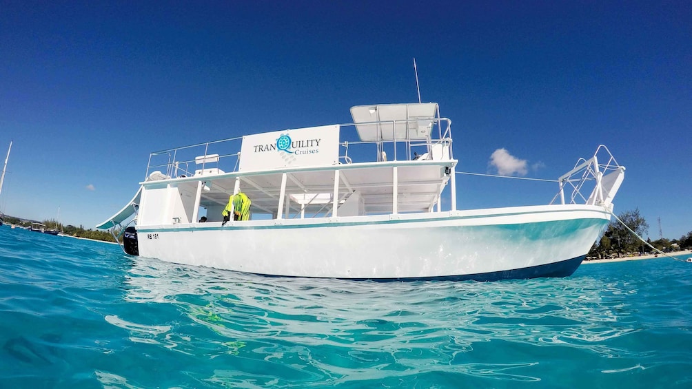Show item 2 of 5. Landscape view of a glass bottom boat in Barbados
