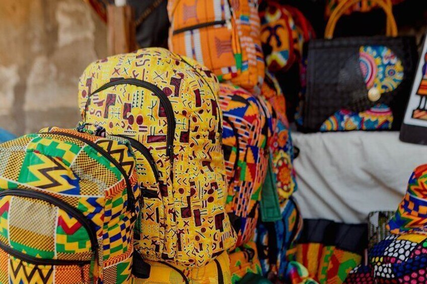 "Travel in style with this vibrant Kente fabric backpack. Join our Accra Textiles and Fashion Tour to uncover the rich history behind these iconic designs. #AshantiKente #ExploreGhana"