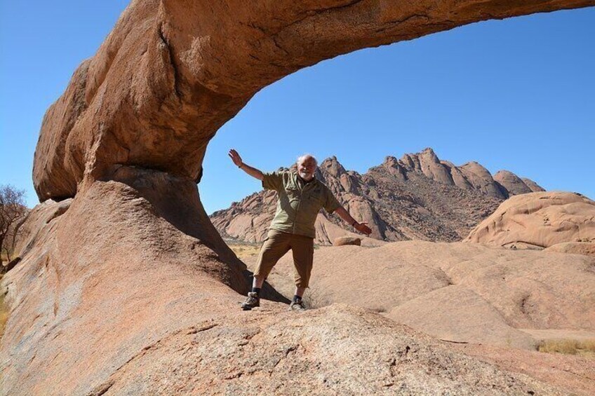 Client enjoying his time at the rock arch 