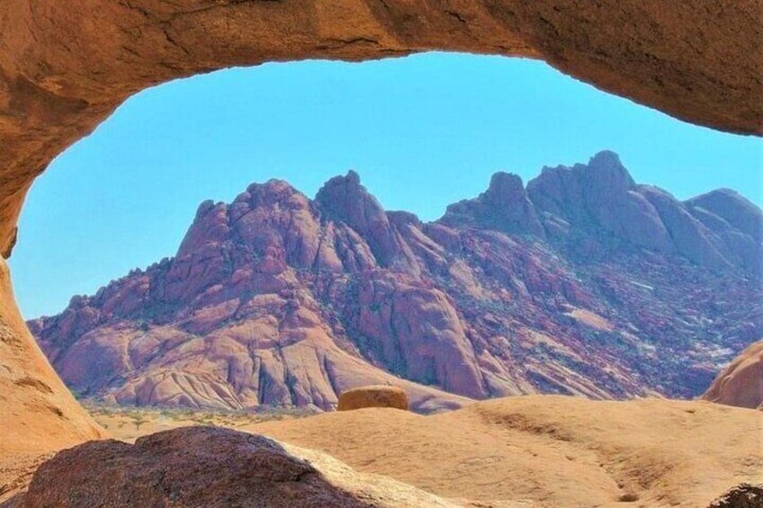 Viewing the mountain through the famous rock arch 